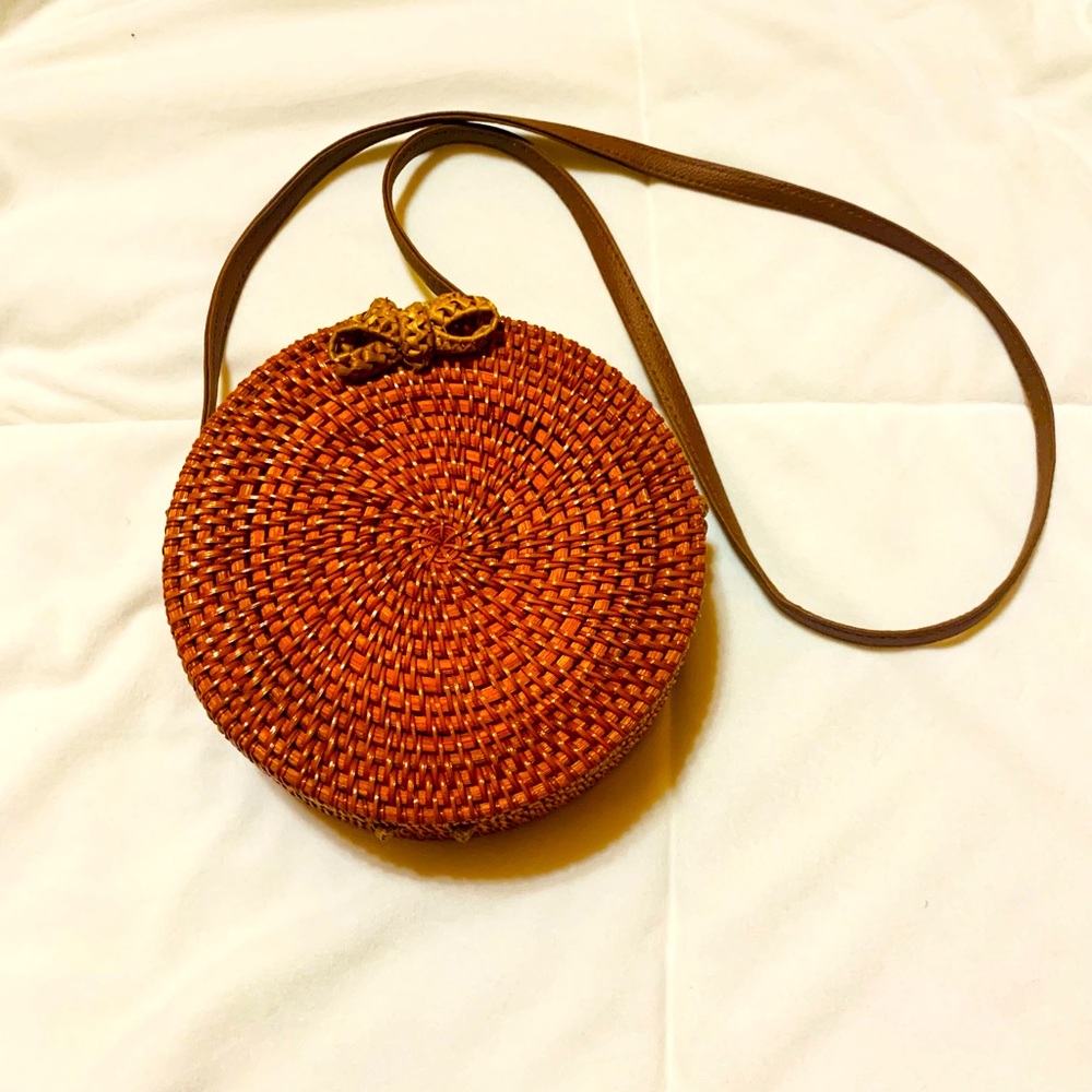 Antik Kraft woven round crossbody purse.